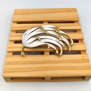 Vintage Monet white enamel gold tone floral motifs brooch